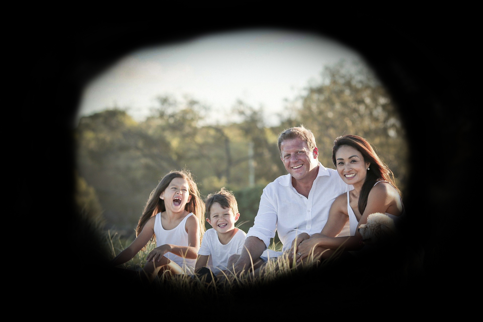 A family photo with a black cloud around it